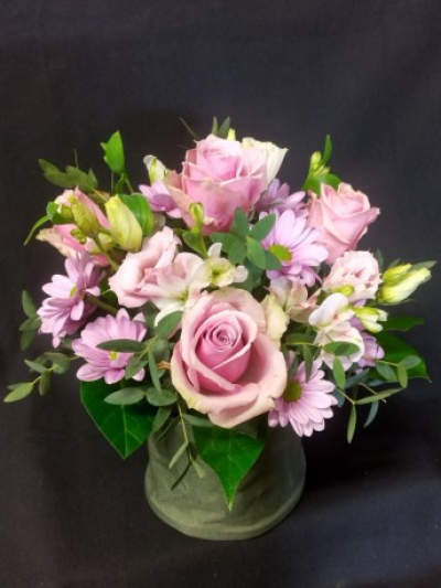 Classic arrangement (Pinks) - A sweet posy arrangement of flowers in tones of pinks set in a linen effect green holder. This arrangement is a perfect gift to send for any occasion. Flower and design may vary. Flowers are arranged and delivered by your local florist By Arrangement. We can deliver to all local areas including Gosport, Fareham, Lee-on-the-Solent, Stubbington and Titchfield. This item is available for same delivery if ordered by 2pm. This item is available for delivery or we offer a click and collect service from our shop. Flower arrangements for every occasion. Although our website is vast and varied we are also aware that some customers have special requirements that we are always available to consult in order to meet all your floral needs. contact details as follows - 02392 520123, use our contact page to send us a message or you can even come into the shop and see us face to face.