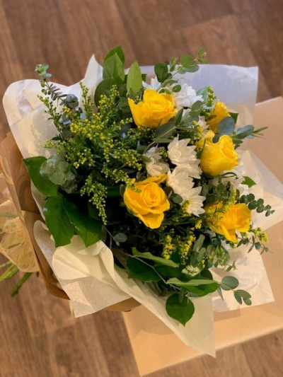 Clarabelle (Yellow bouquet "BELLE" range - Clarabelle is just one bouquet in our what we like to call our "BELLE" range, all the designs in this range are first and foremost beautiful high quality flowers tied in a pretty gathered style looking absolutely gorgeous in a no fuss but stunning design that allows the flowers to speak for themselves. All the incredibly lucky recipient had to do is pop them into a vase and enjoy. A pretty name for a pretty bouquet, in delicate and bright tones of yellow. Deriving from the Latin meaning "Bright and Famous" Clarabelle certainly lives up to it's name and will brighten up anyones day. A selection of gorgeous yellow and white flowers beautifully wrapped in soft tissue ans paper then finished with an organza bow. Design and flower may vary. Bouquet of flowers arranged and delivered by your local florist By Arrangement. We deliver to all local areas including Gosport, Fareham, Lee-on-the-Solent and Stubbington. Flower delivery and collections available.