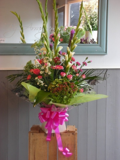 The WOW factor - A beautiful box of flowers that never fail to live up to it's name, suitable for any occasion. Flower and colours may vary.Product shown is the deluxe. All our designs are made by our highly trained skillful florists on site. On our website you can find flower arrangement for every occasion. Although our website id vast and varied we are also aware that some customers have special requirements that we are always available to consult in order to meet all your floral needs.We deliver to all areas in our locality including Gosport, Fareham, Lee-on-the-Solent, Stubbington, Titchfield and their surrounding areas. We offer same day delivery on all orders placed before 2pm. A click and collect service is offered through our website if you prefer. Contact details as follows, to send us an email please use our contact page, you can give us a call on 023 92520123 or even come into the shop and see us face to face.