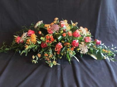 Casket Spray Autumnal Colours - Casket funeral spray arrangement in warm autumnal colours and flowers. Please note that the design and flower may vary from the image shown.

We deliver to all areas in our locality, including Gosport, Fareham, lee-on-Solent, Stubbington, Titchfield and their surrounding areas. We offer a same day delivery on all orders placed before 2pm. A click and collect service is offered through our website if you prefer. All of our designs are made by our highly trained skilful florists on site. On our website you can find flower arrangements for every occasion. Although our website is vast and varied we aware that some customers have special requirements that we are always available to consult in order to meet all your floral needs. Contact details as follows, you can call us on 023 92520123, use our contact page to send us a message or even come into the shop and see us face to face.