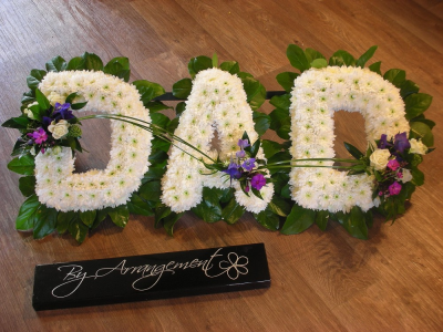 DAD Floral Letter Tribute - DAD floral letter tribute with foliaged edge, white chrysanthemum base and coloured posies of your choice. Please put posy colour requirements in special request box if you are ordering online or you can always call us on 023 92520123 to discuss the colours. Flower choice for the posies may vary from the image shown. All of our floral arrangements are made on site by our highly trained skilful florists on site. We deliver to all funeral directors in our locality including Gosport, Fareham, Lee-on-the-Solent, Stubbington, Titchfield and their surrounding areas. Although our website is vast and varied we are also aware that some customers may have special requirements that we are always available to consult in order to meet all of your floral needs. Our contact details are as follows. You can call us on 023 92520123, use our contact page through our webiste to send us a message or even come into the shop and see us face to face.