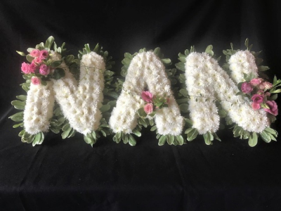 NAN Floral Letters Tribute - NAN floral tribute design with foliaged edge, white chrysanthemum base and flower posies in colour of your choice. Please put your posy colour requirements in special request box if ordering online or you can call us on 023 92520123 to discuss. Flower choice may vary from the image shown in the picture. All of our floral designs are made by our highly trained skilful florists on site. We can deliver to all funeral directors in our locality including Gosport, Fareham, Lee-on-the-Solent, Stubbington, Titchfield and their surrounding areas. Although our website is vast and varied we are also aware that some customers may have special requirements that we are always available to consult in order to meet all of your floral needs. Our contact details are as follows. If you would like to speak to someone in person then please call us on 023 92520123, you can use our contact page through our website to send us a message or even come into the shop and see us face to face.