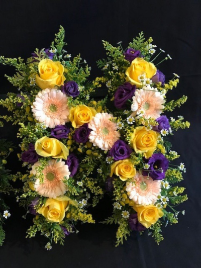 Mixed Flower Letters - Mixed flower funeral letters with roses as the main flower through the design, the choice of colour is up to you, please state in the special request box what colour you require. (Please note that certain times of the year some rose colour choices maybe more expensive). Although an "N" is shown in the image, all letters and word combinations are available in this range, with prices starting from £60.00 per letter.  Please state in special requests what letters you require. Each letter is approximately a minimum of 12 inches high and the overal length is approximately 36 inches. Please allow 3 working days to purchase this design. We deliver to all funeral directors in our locality, Gosport, Fareham, Lee-on-th-Solent, Stubbington, Titchfield and the surrounding areas. If you would prefer to speak to someone about ordering this item please give us a call on 023 92520123, we would be happy to help, thank you.