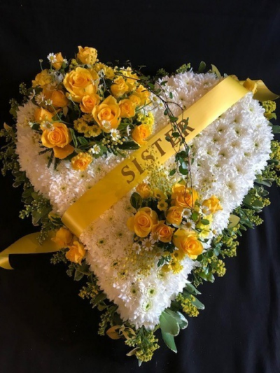 Very pretty funeral heart - A very pretty heart design, posies in a colour of your choice, with a delicate foliage and flower border. A ribbon sash with name/relation lettering of your choice. if you are ordering online then please write in the ( Special Request) box what colour you would like the posies to be in and what name/relation you would like for the lettering. Flower may vary from the image shown. All of our designs are made by our highly trained skilful florists on site. We deliver to all funeral directors in our locality including Gosport, Fareham, lee-on-the-Solent, Stubbington, Titchfield and their surrounding areas. Although our website is vast and varied we are also aware that some customers may have special requirements that we are always available to consult in order to meet all of your floral needs. Our contact details are as follows. You can use our contact page through our website to send us a message, call us on 023 92520123 or even come into the shop and see us face to face.