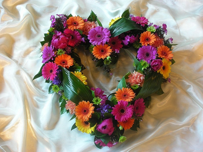 Colourful funeral heart - A beautiful funeral heart design in colourful viberant mixed gerbera, curled leaf foliage and other flower giving a contemporary style to the arrangement. Please note that the flower and colour may vary to the image that is shown. All of our floral designs are made by our highly trained skilful florists on site. We would reqire 2 working days to produce this items. We deliver to all funeral directors in our locality including Gospotr, Fareham, Lee-on-the-Solent, Stubbington, Titchfield and their surrounding areas. Although our website is vast and varied we are also aware that some customers may have special requirements that we are always available to consult in order to meet all of your floral needs. Our contact detalis are as follows. You can call us on 023 92520123, use our contact page through our website to send us a message or even come into the shop and see us face to face.
