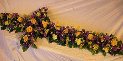 Mixed Flower Funeral Cross - A mixed flower floral cross tribute, available in standard colours and flowers of your choice (Roses, Carnations, Chrysanthemum, germini and fillers) Please note the flower may vary due to the season and availabilty. Available in 2 and 3 foot sizes. All of our floral desings are made by our highly trained skilful florists on site. Please allow 3 working days for us to produce this design. We deliver to all funeral directors in our locality, including Gosport, Fareham, Lee-on-the-Solent, Stubbington, Titchfield and their surrounding areas. Although our website is vast and varied we are also aware that some customers may have special requirements that we are always available to consult in order to meet all of your floral needs. Our contact details are as follows, you can call us on 023 92520123, use our contact page through our website to send us a message or even come into the shop and see us face to face.