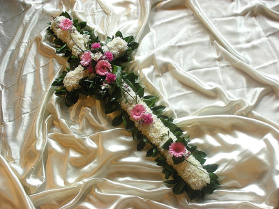 Funeral Cross with foliaged edge - Cross with a pretty foliaged edge, white chrysanthemum base with beautiful floral posies at intervals along the cross, creating an elegant and delicate design. If you require a different colour posy designs we are always happy to oblige, please put your colour preference in the special request box when ordering this item. If you would like to speak to some one about this item then please give us a call on 02392 520123.  This item is available in 2ft (Standard) and 3ft (Deluxe) sizes. We require 3 working days to produce this design. We deliver to all funeral directors in our locality, including Gosport, Fareham, Lee-on-the-Solent, Stubbington, Titchfield and surrounding areas. Although our website is vast and varied we are also aware that some customers may have special requests that we are always available to consult in order to meet all of your floral needs. our contact details are as follows, you can call us on 023 92520123, use our contact page through our website to send us a message or even come into the shop and see us face to face.