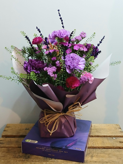 Flower Posy and Chocolates - A sweet flower posy in tones of purples and pinks with chocolates. Flowers for all occasions. Florist in Gosport. Flowers delivered Gosport. Same day Flower delivery.