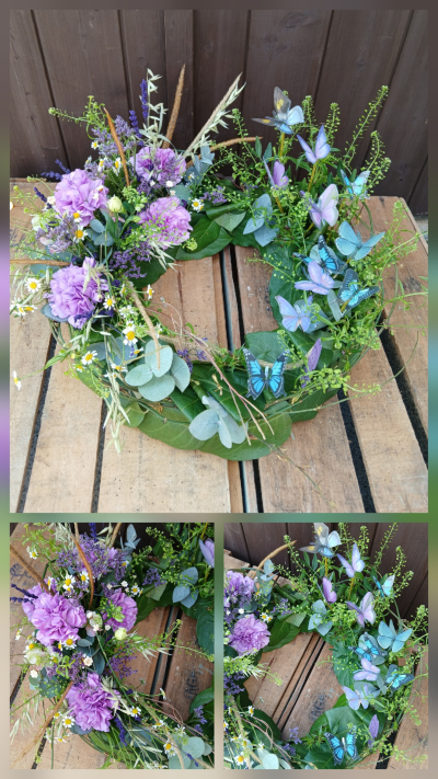 Butterfly wreath ring funeral tribute - Funeral flowers Gosport. Butterfly funeral flower tribute. Send funeral flowers Gosport, Fareham. Funerals Gosport. Local funeral flowers Gosport